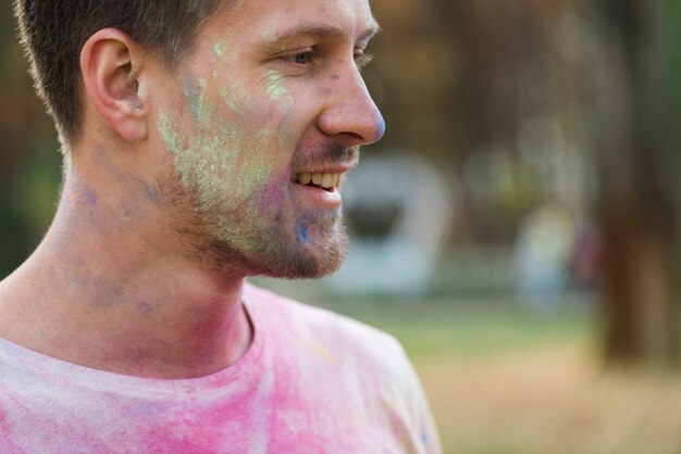 Close-up of cheek covered in powdered paint