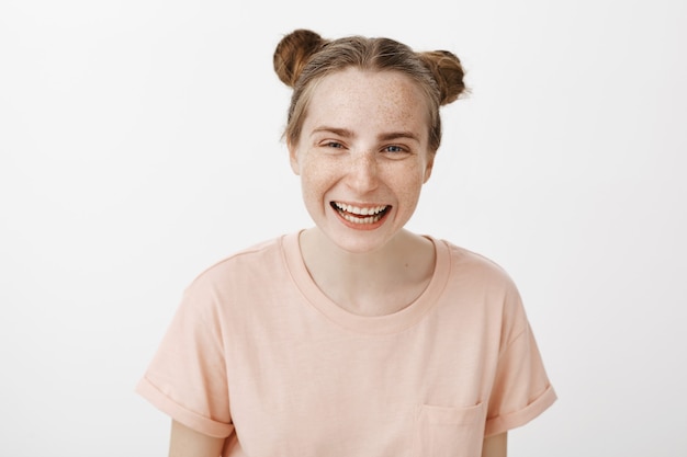 Close-up of cheerful friendly and carefree redhead girl laughing