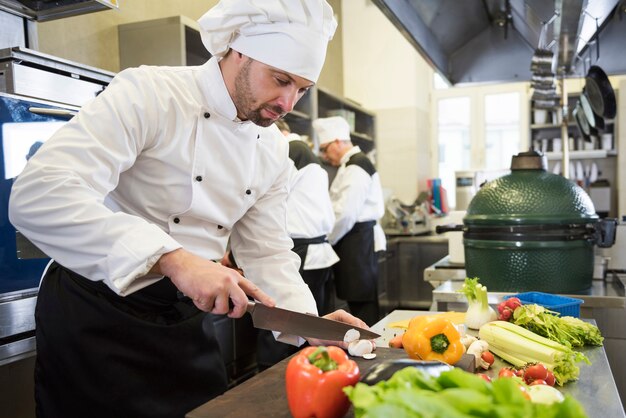 Close up on chef cooking in restaurant kitchen