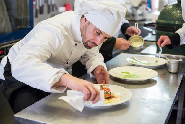 Close up on chef cooking in restaurant kitchen