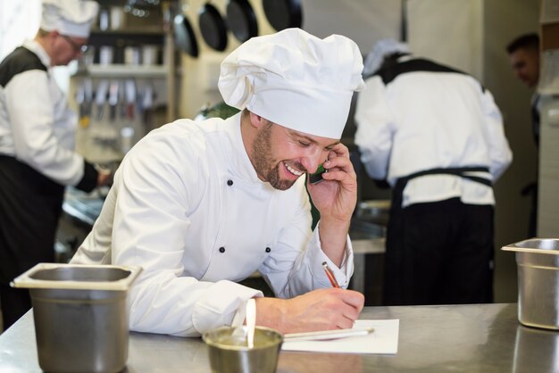 Close up on chef cooking in restaurant kitchen