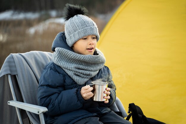 Close up on child in camping with his parents