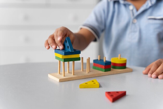 Close up on child enjoying didactic game