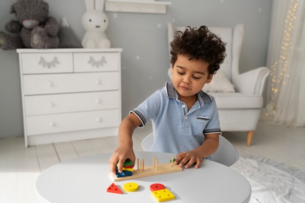 Close up on child enjoying didactic game