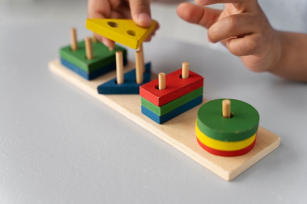 Free photo close up on child enjoying didactic game