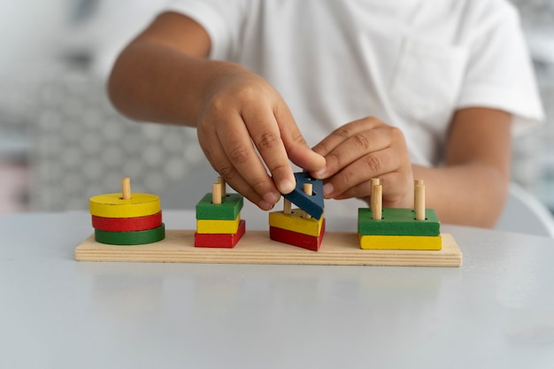 Close up on child enjoying didactic game