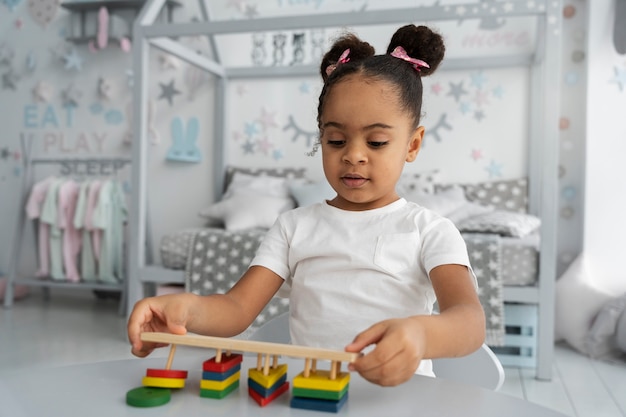 Free photo close up on child enjoying didactic game