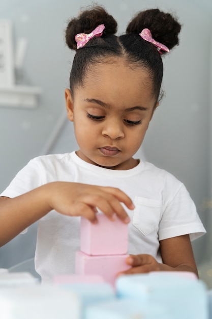 Close up on child enjoying didactic game