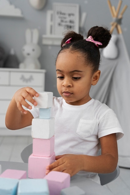 Close up on child enjoying didactic game