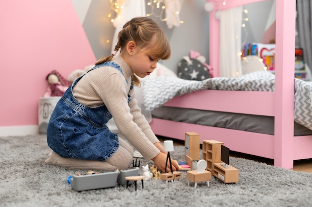 Close up on child playing in her room