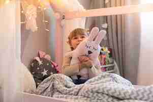 Free photo close up on child playing in her room