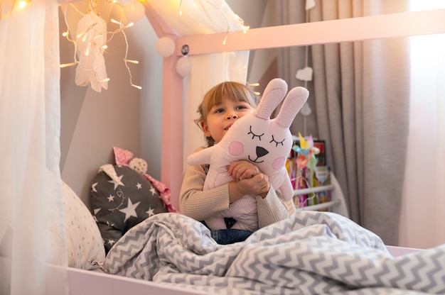 Close up on child playing in her room