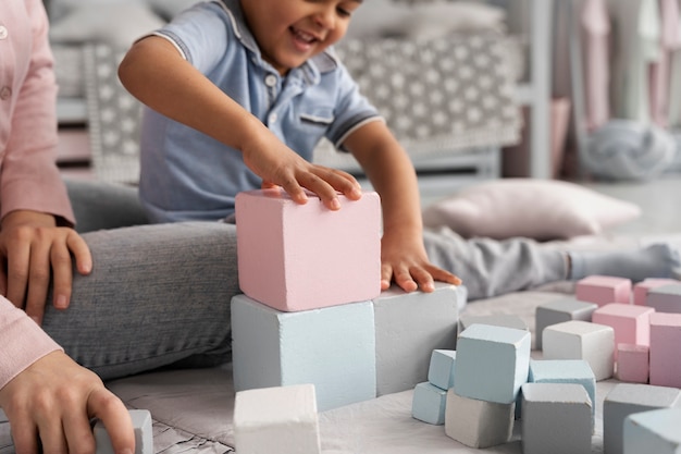 Close up on child playing with didactic game