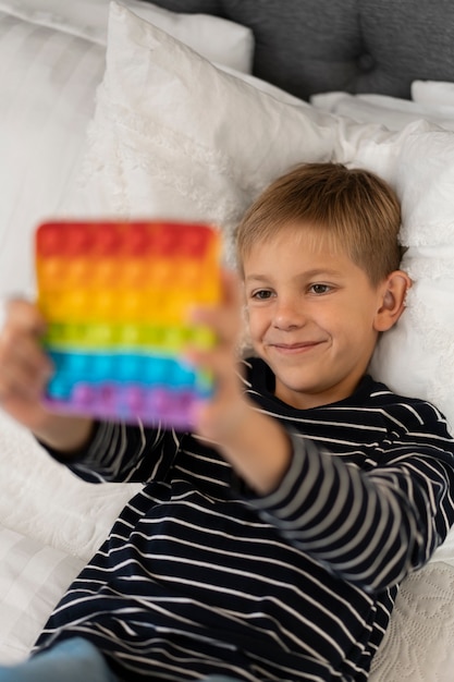 Free photo close up on child playing with pop it toy