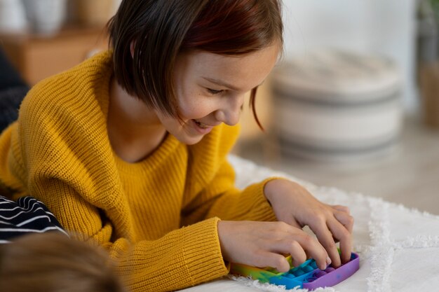 Close up on child playing with pop it toy