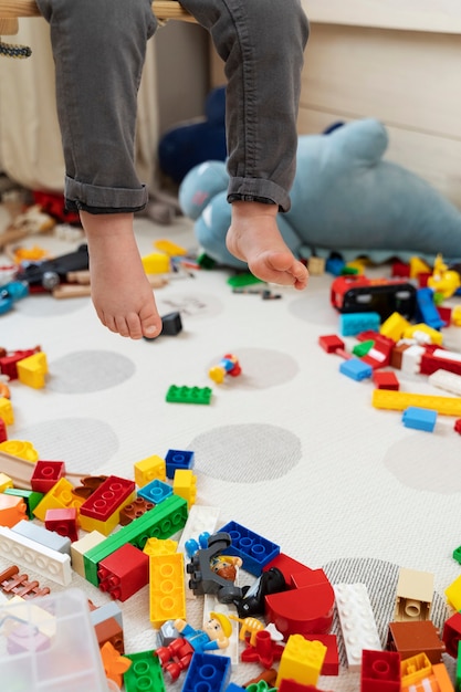 Close up child in swing at messy home