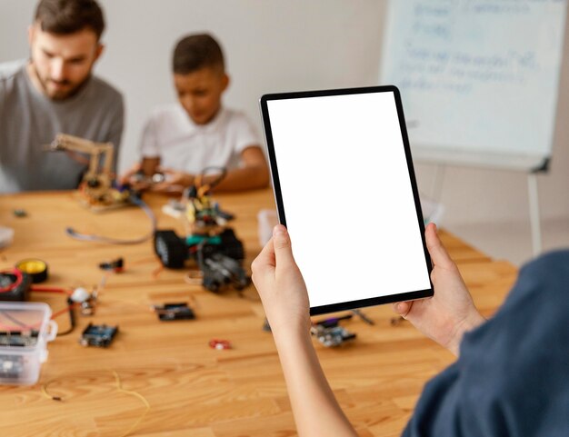 Close up child with tablet