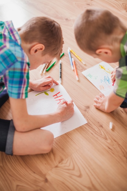 Close-up of children drawing for mother's day