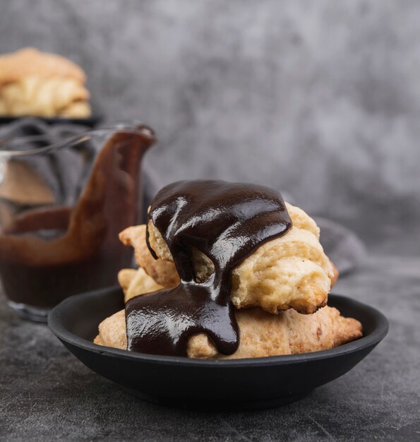 Close-up chocolate glazed croissants