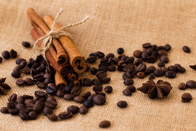 Close-up cinnamon sticks with coffee beans