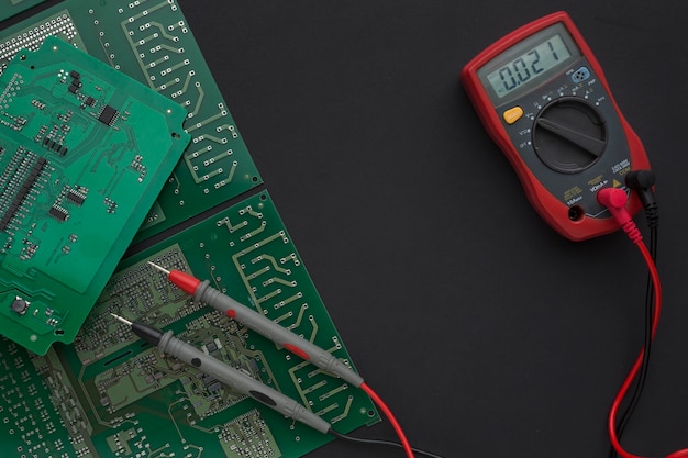 Close-up circuit board with multimeter