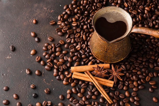 Close-up coffee beans with cinnamon stick