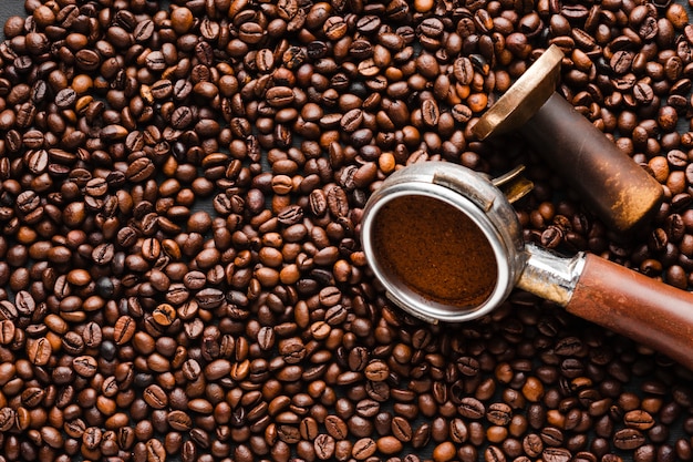 Close-up coffee beans with tamper