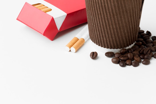 Free photo close-up coffee and cigarettes