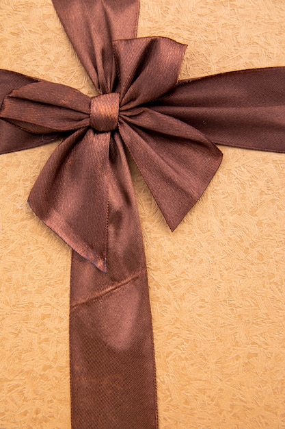 Close up coffee coloured ribbon with bow