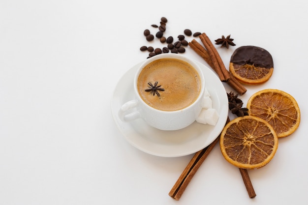 Close-up coffee cup on a tray with anise