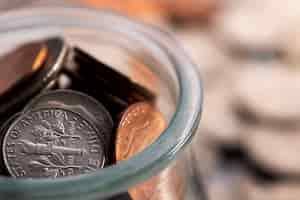 Free photo close up on coins in jar