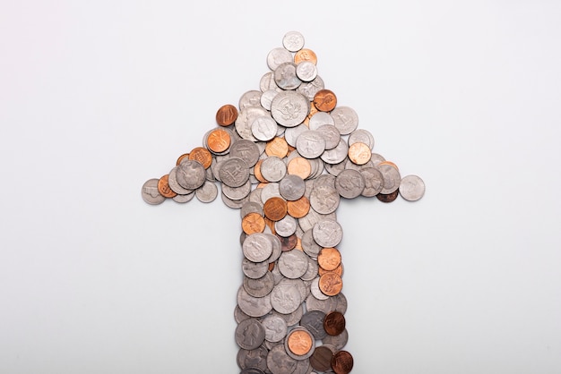 Free photo close up on coins shaped as an arrow