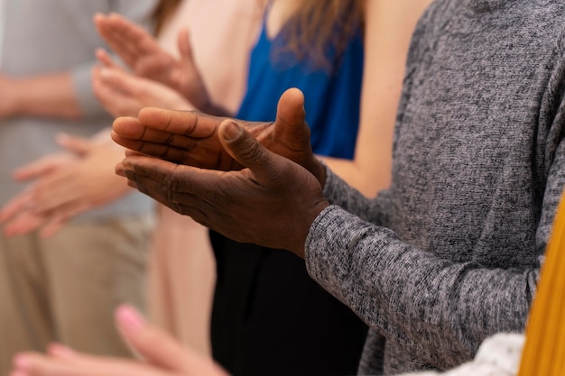 Close up colleagues applauding