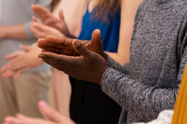 Close up colleagues applauding