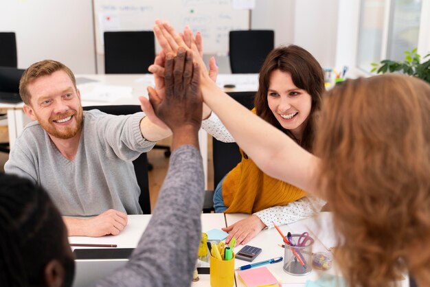 Close up colleagues high five