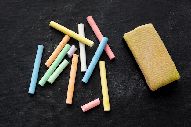 Close-up colored chalk with sponge