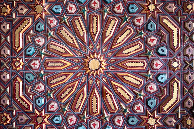 Close up of colored ornament on wood in traditional oriental style.