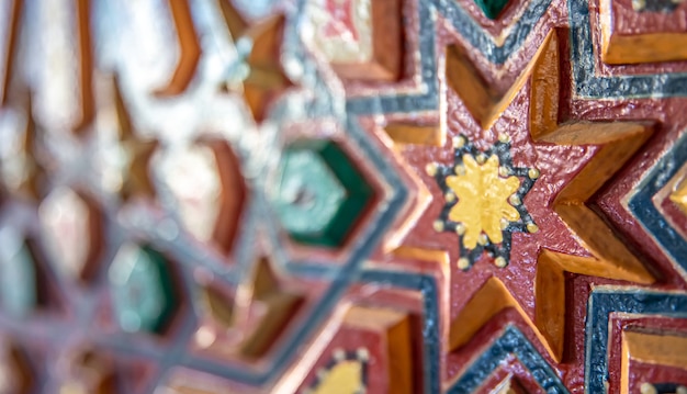 Close up of colored ornament on wood in traditional oriental style