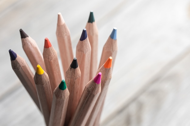 Free photo close up of colored pencils for drawing on blurred background copy space.