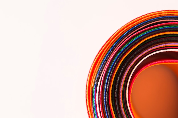 Close-up of colorful curved ribbons on white background