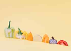 Free photo close-up of colorful raw vegetables on yellow surface