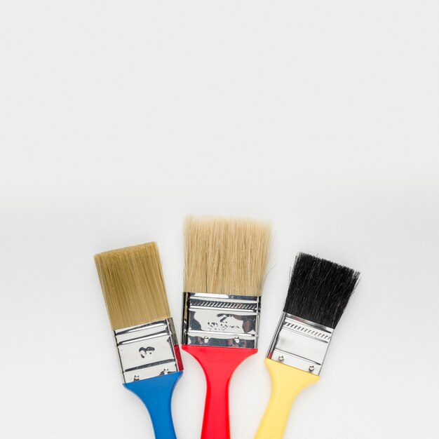 Close-up colourful paint brushes with copy space