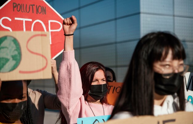 Close up community protesting with masks