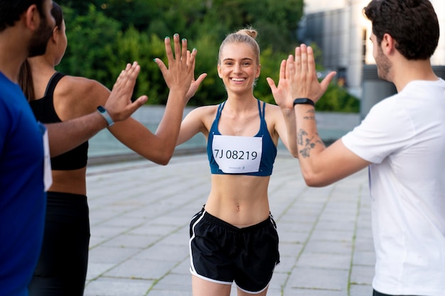 Free photo close up competitors high fiving