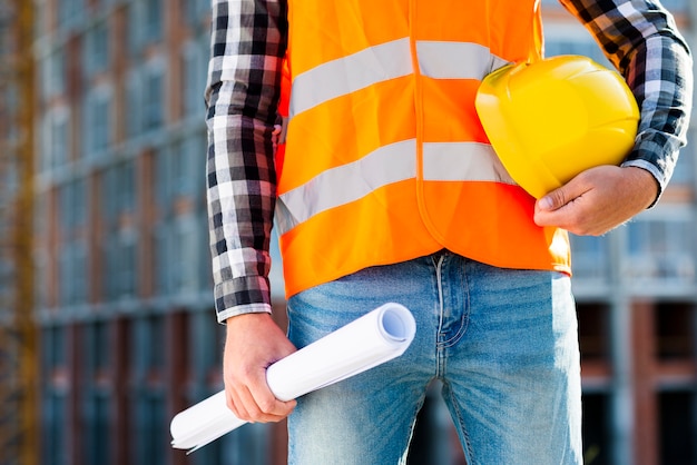 Free photo close-up construction worker holding helmet