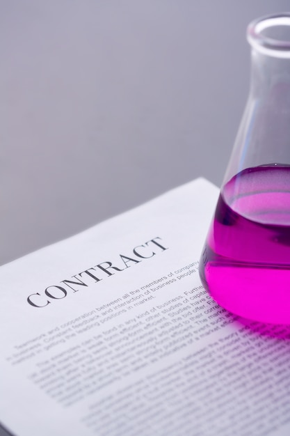 Close-up of a contract with a flask