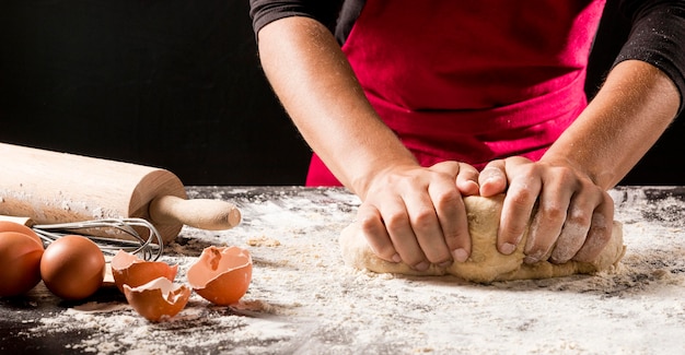 Close-up cook making dough