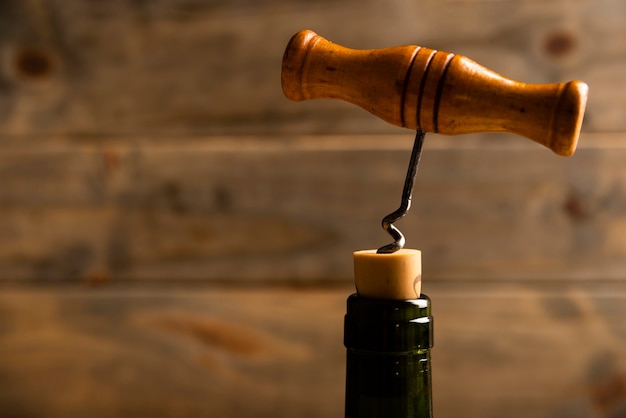 Close-up corkscrew with wooden background