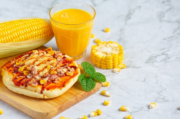 Close up on corn pizza ready to eat