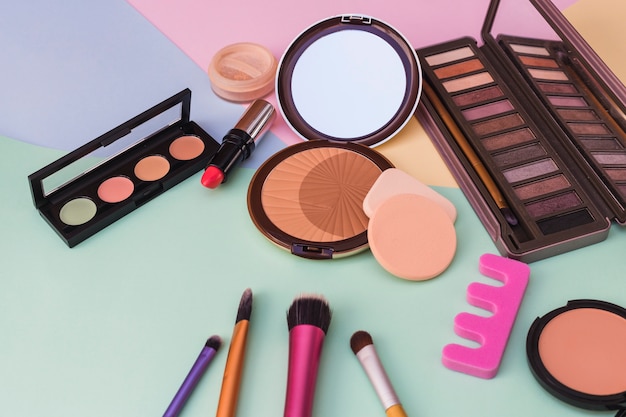 Close-up of cosmetics products on colored background